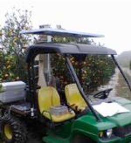all terraine vehicle in citrus grove used for collection